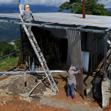 Building on to the dryer buildeing honduras coffee growers